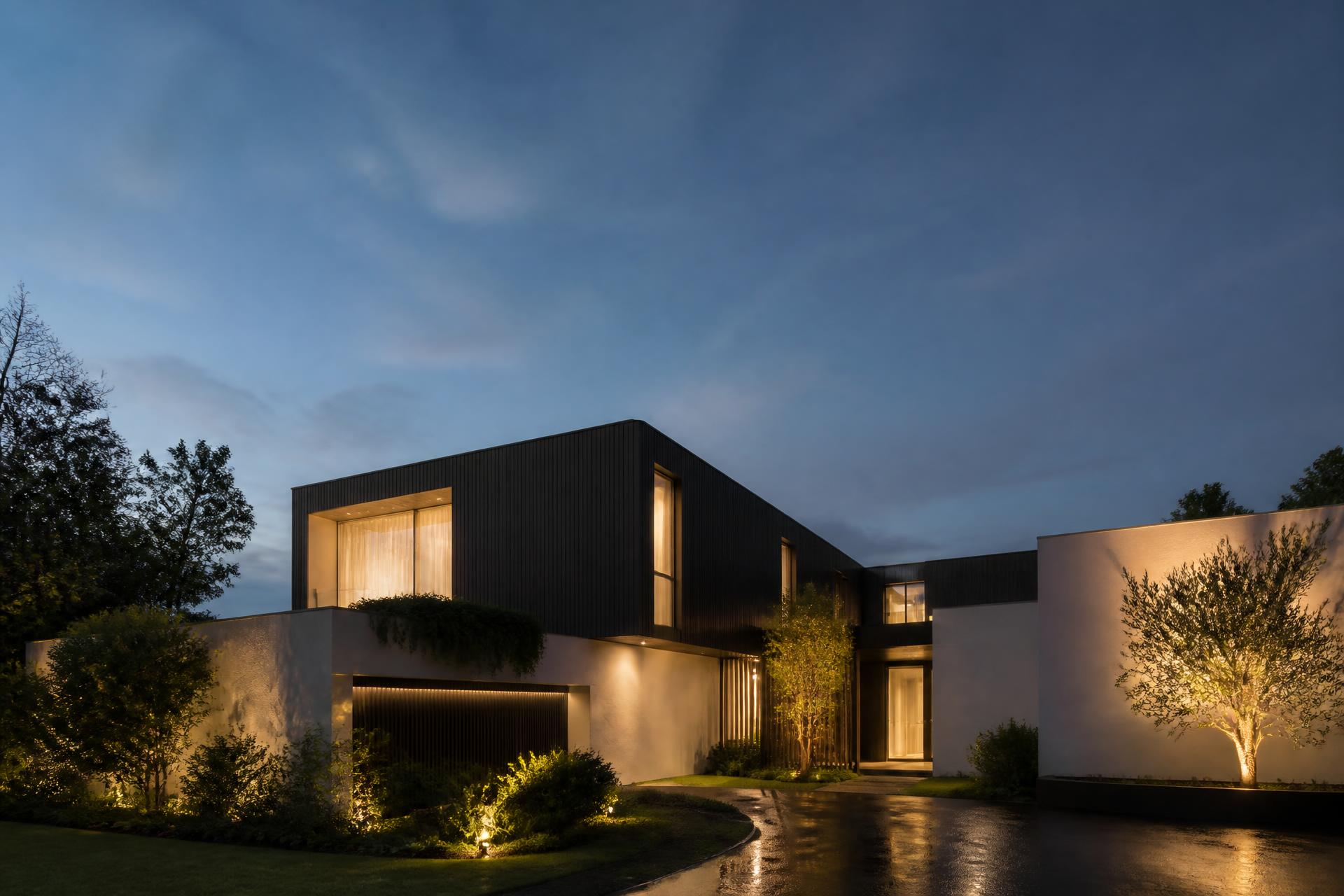 Modern Brisbane luxury home lit at dusk